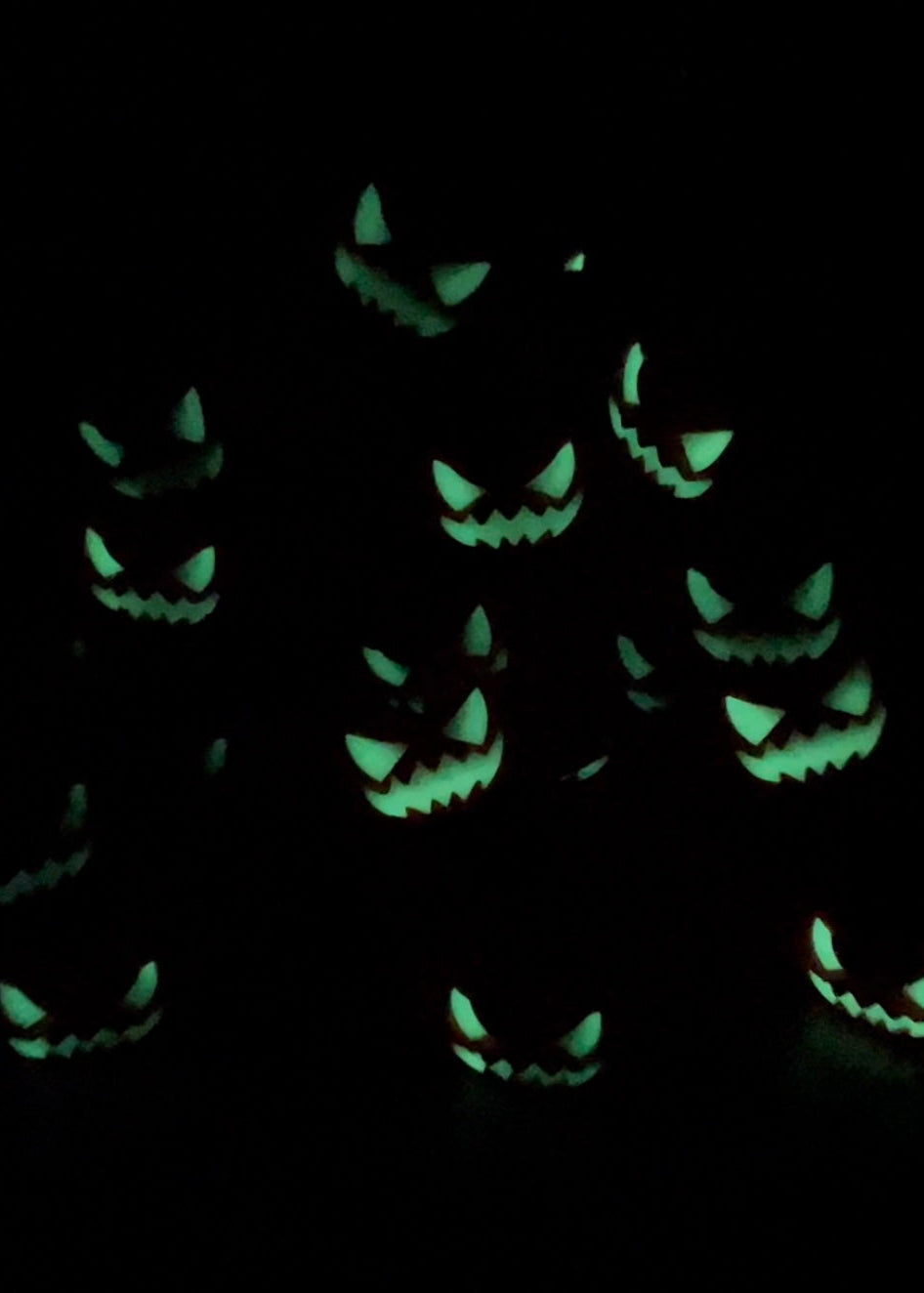 pumpkin faces glowing in the dark